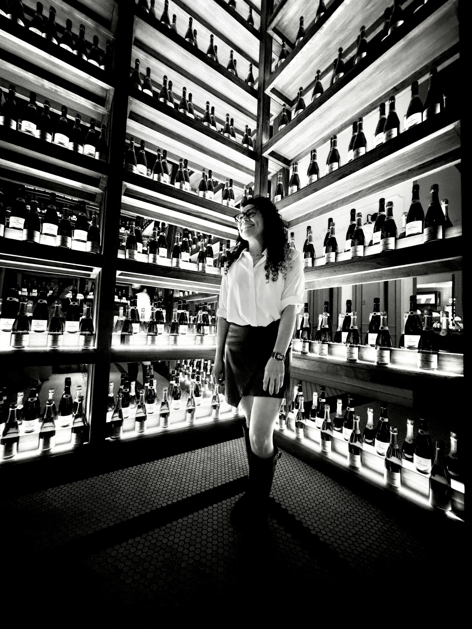 Corina in a wine cellar, black and white
