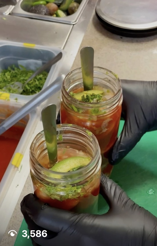 Reel still: two seafood cocktails in jars being finished with avocado, 3,586 views